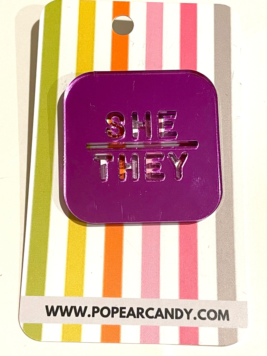 She/They pronoun badge